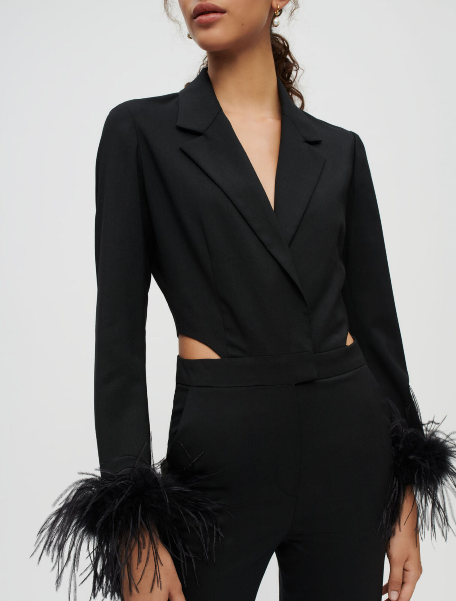 Combination pants in black with feathers