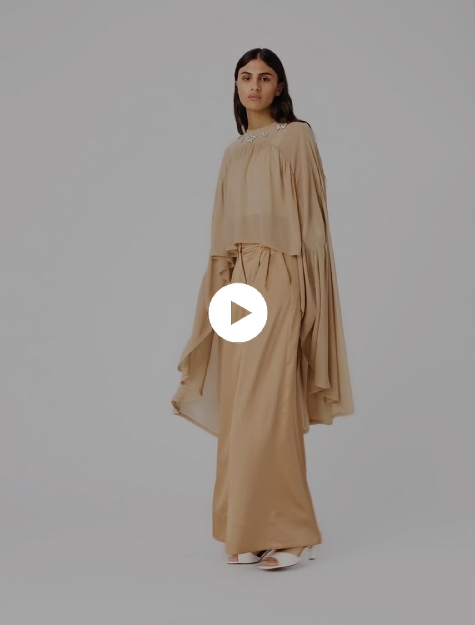 Cape top with jewel collar