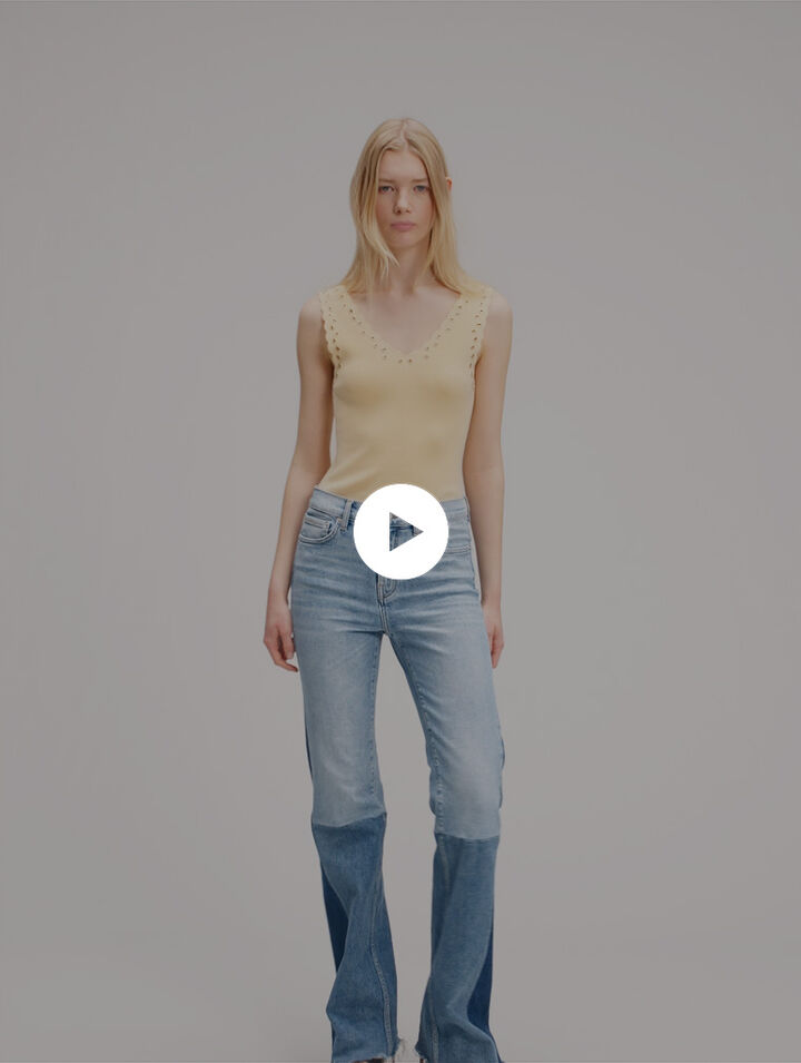 Top en maille &agrave; &oelig;illets