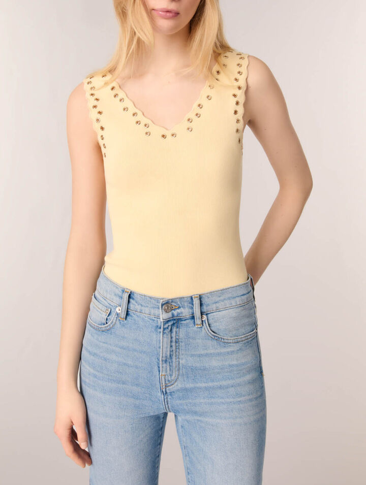 Top en maille &agrave; &oelig;illets
