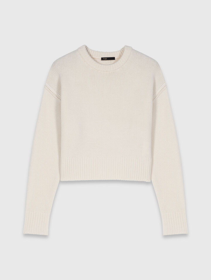 Pull avec broche florale