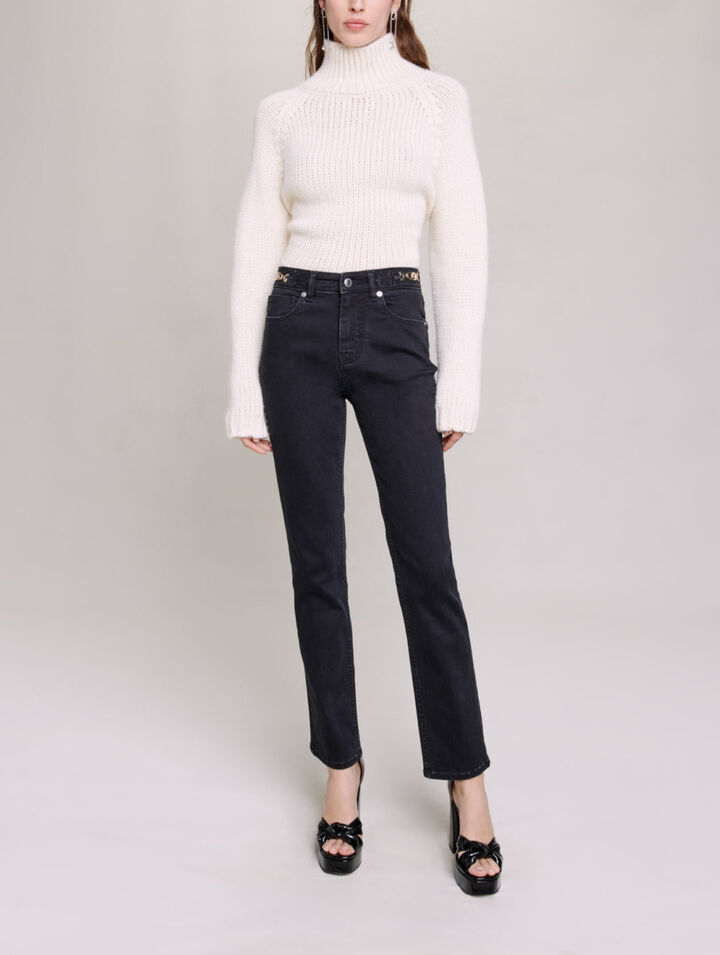 Jeans with curb chains and fringing