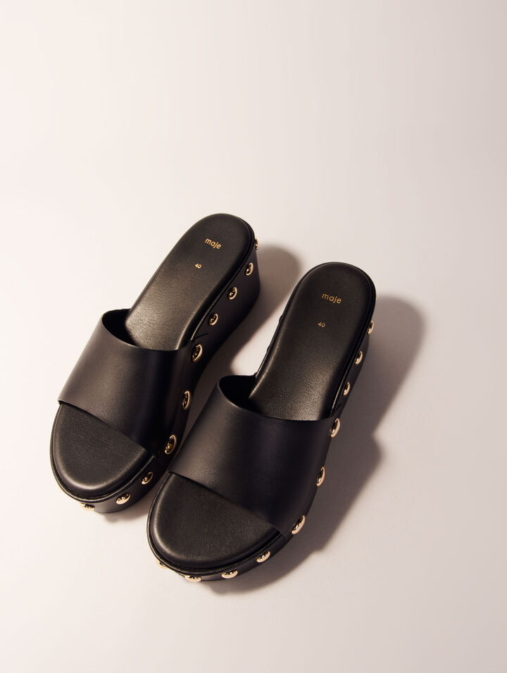 Mules compensées en cuir à studs