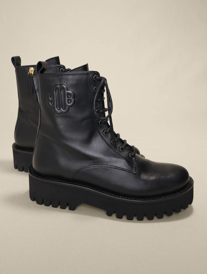 Black leather lace-up boots