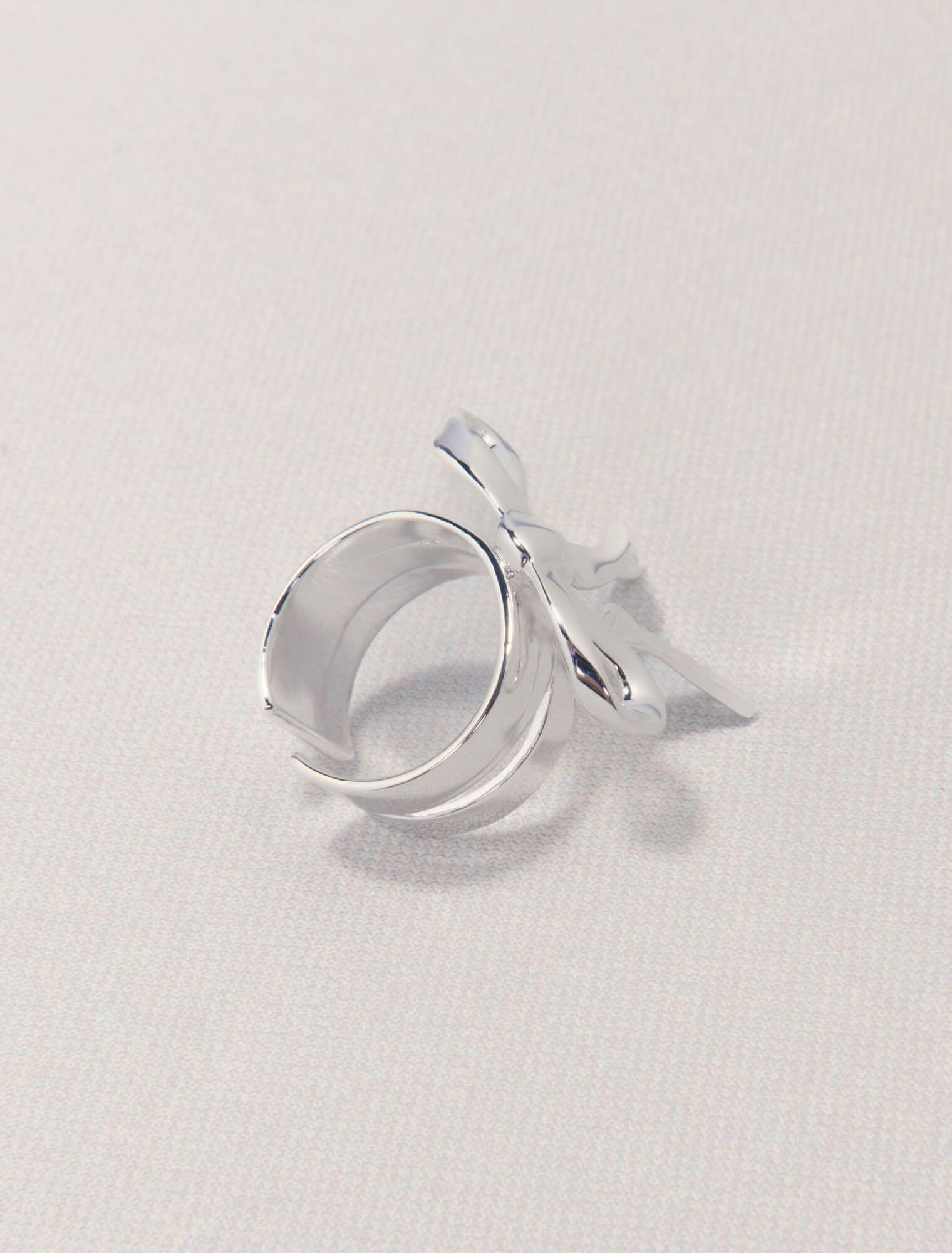 Open silver bow ring