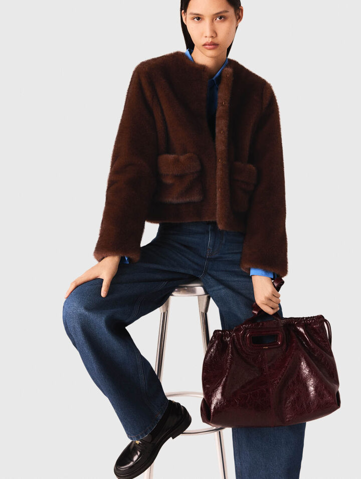Manteau court en fausse fourrure