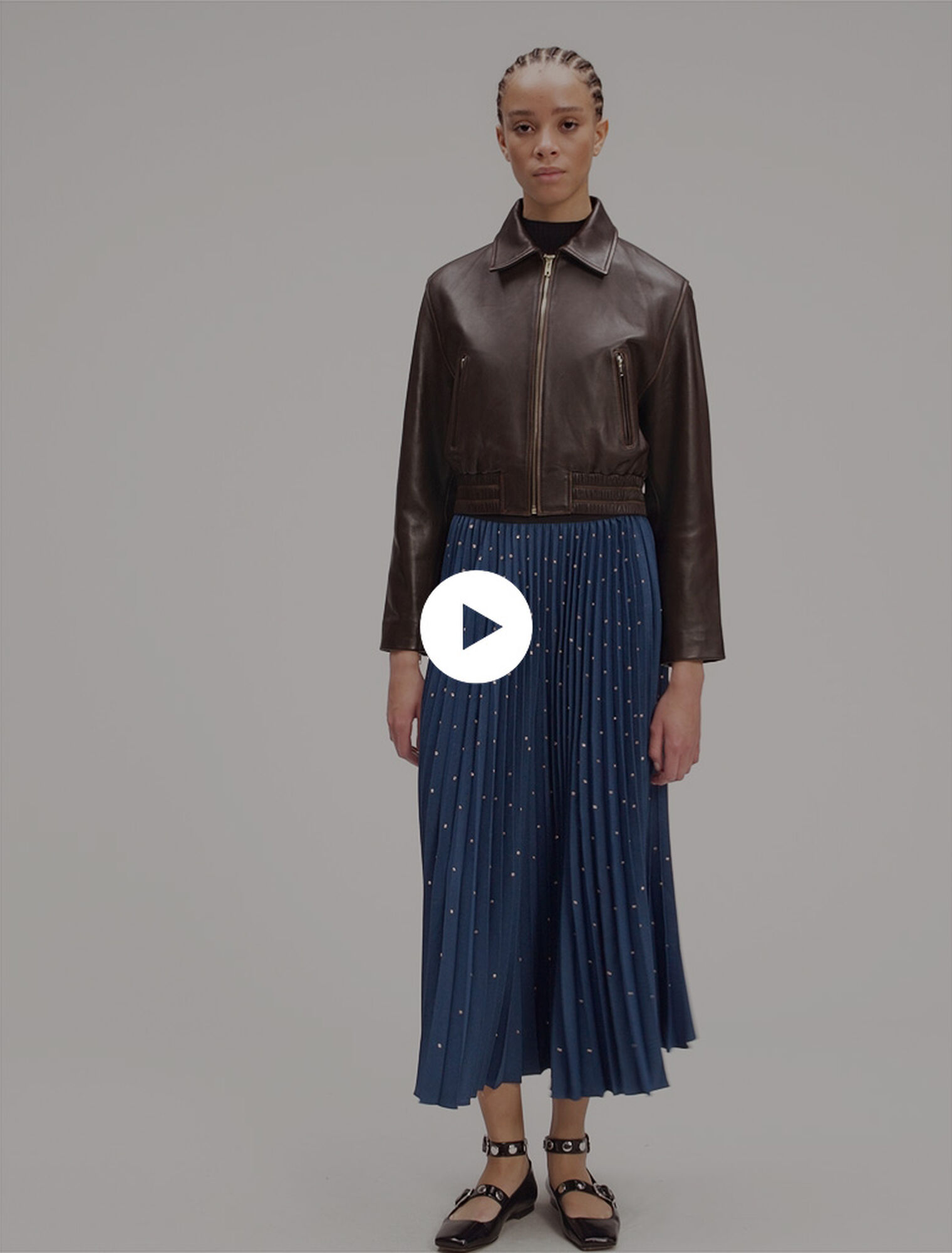 Long pleated skirt with studs
