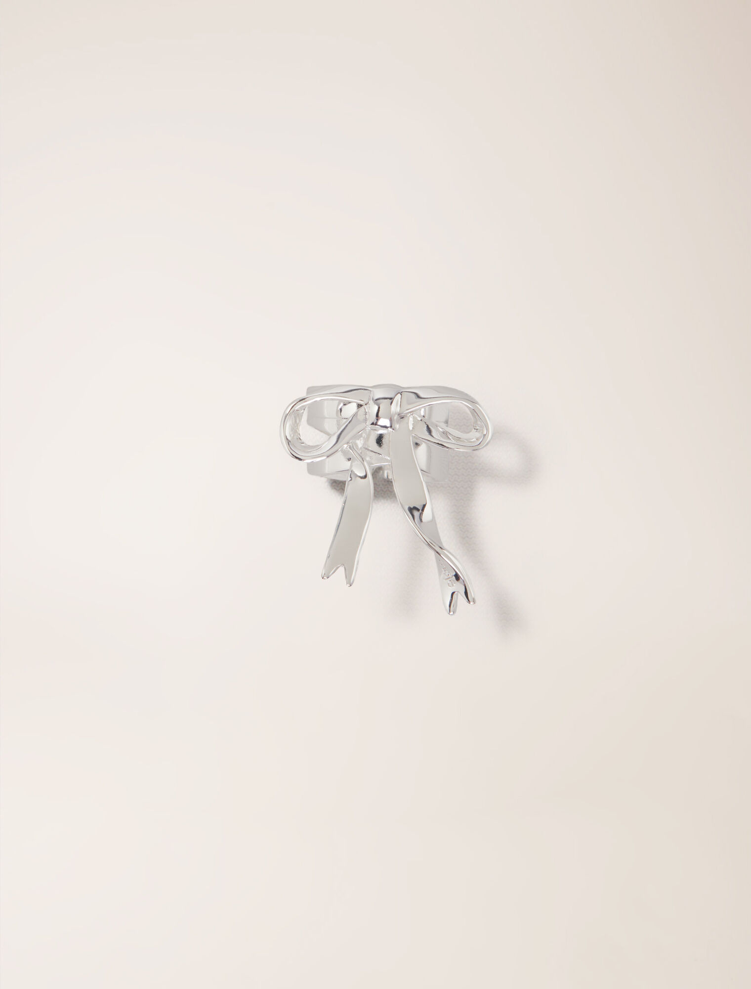 Open silver bow ring
