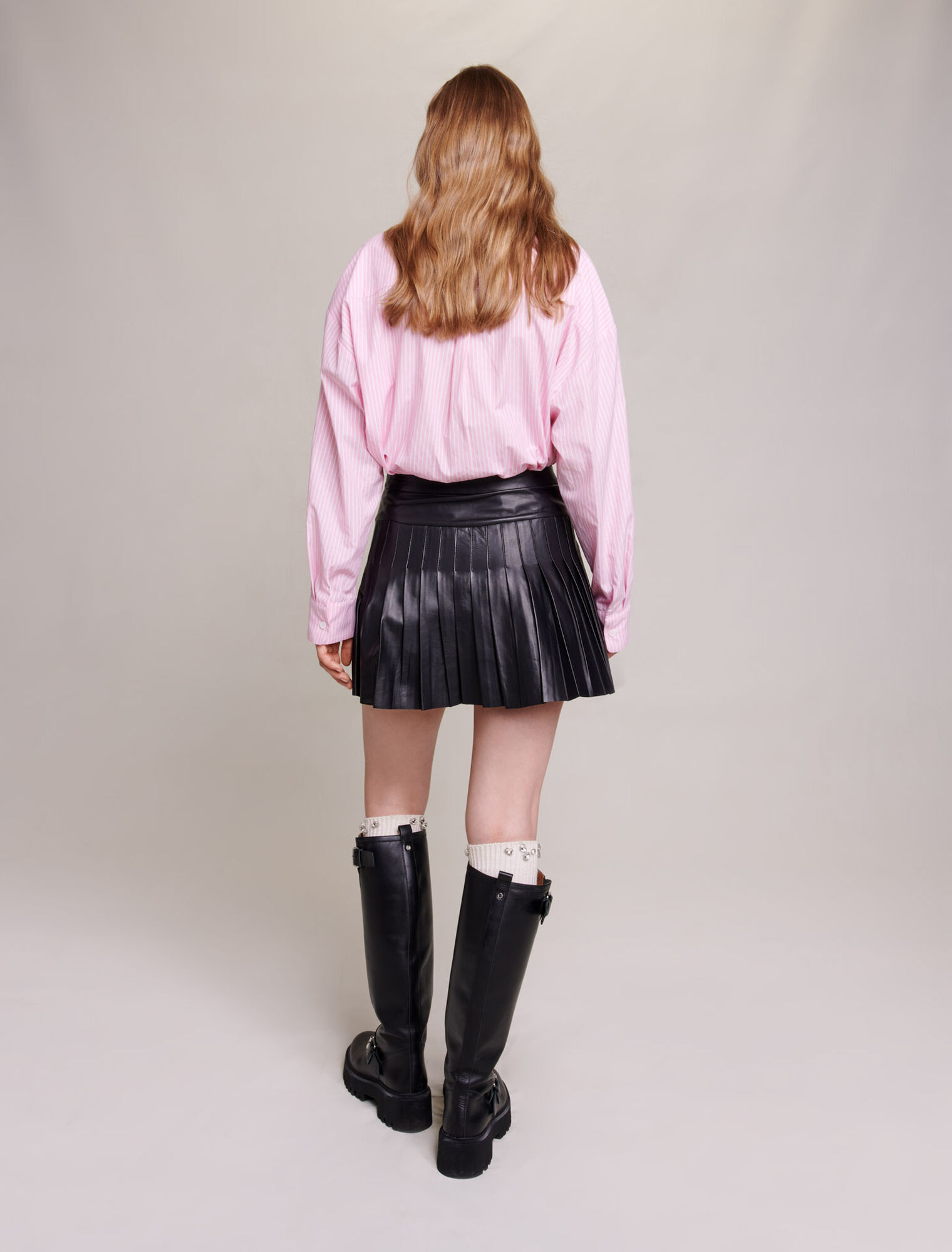 Pleated, flared leather skirt
