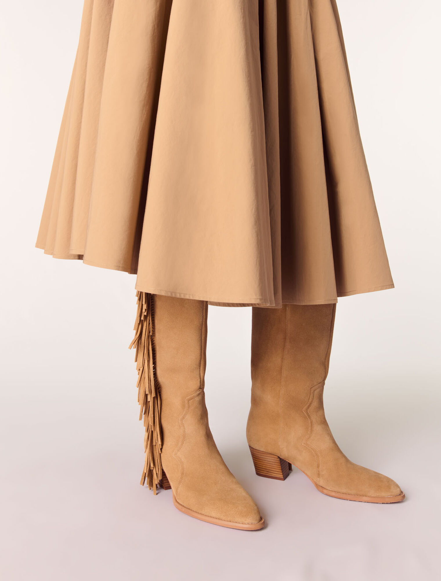 Fringed suede cowboy boots