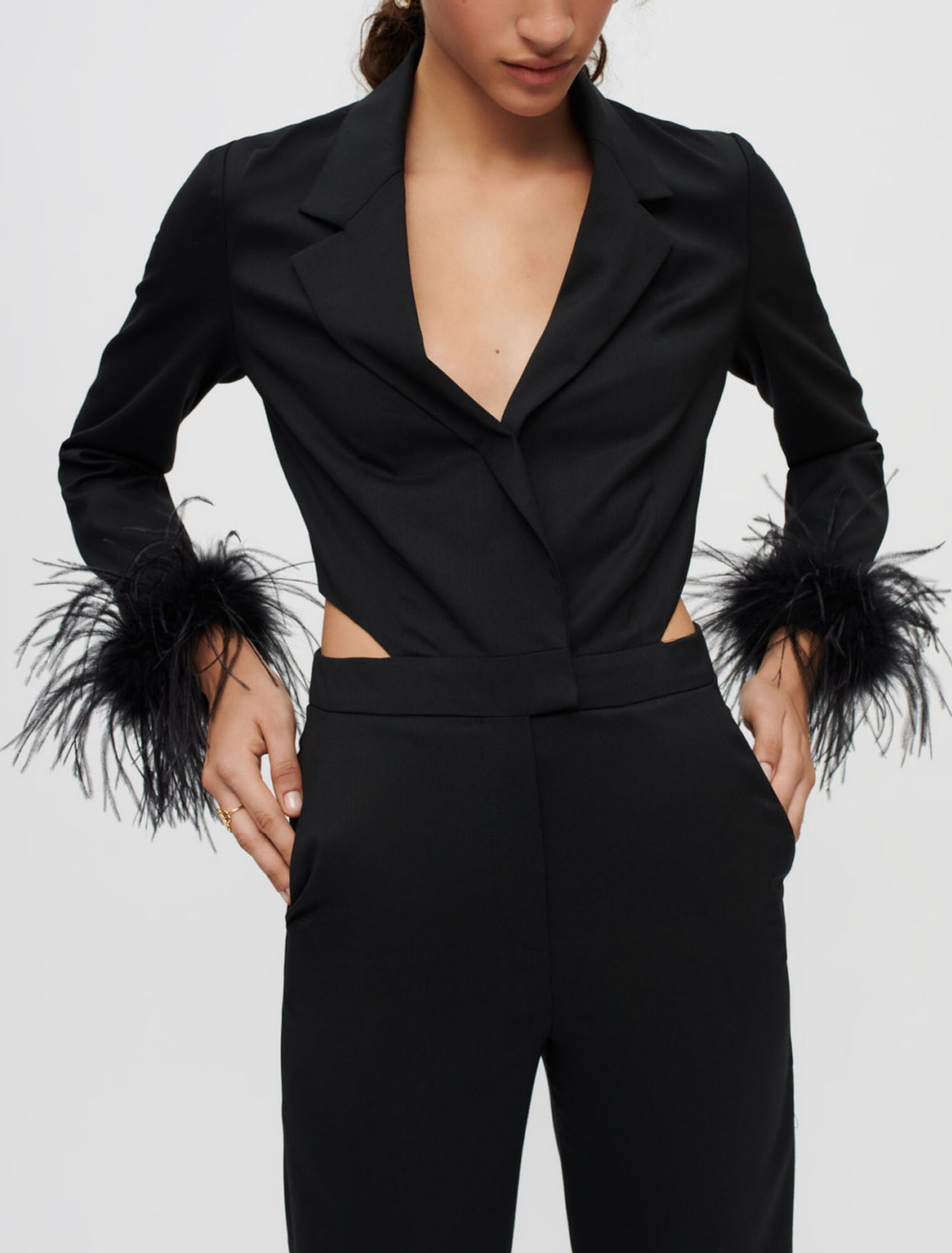 Combination pants in black with feathers