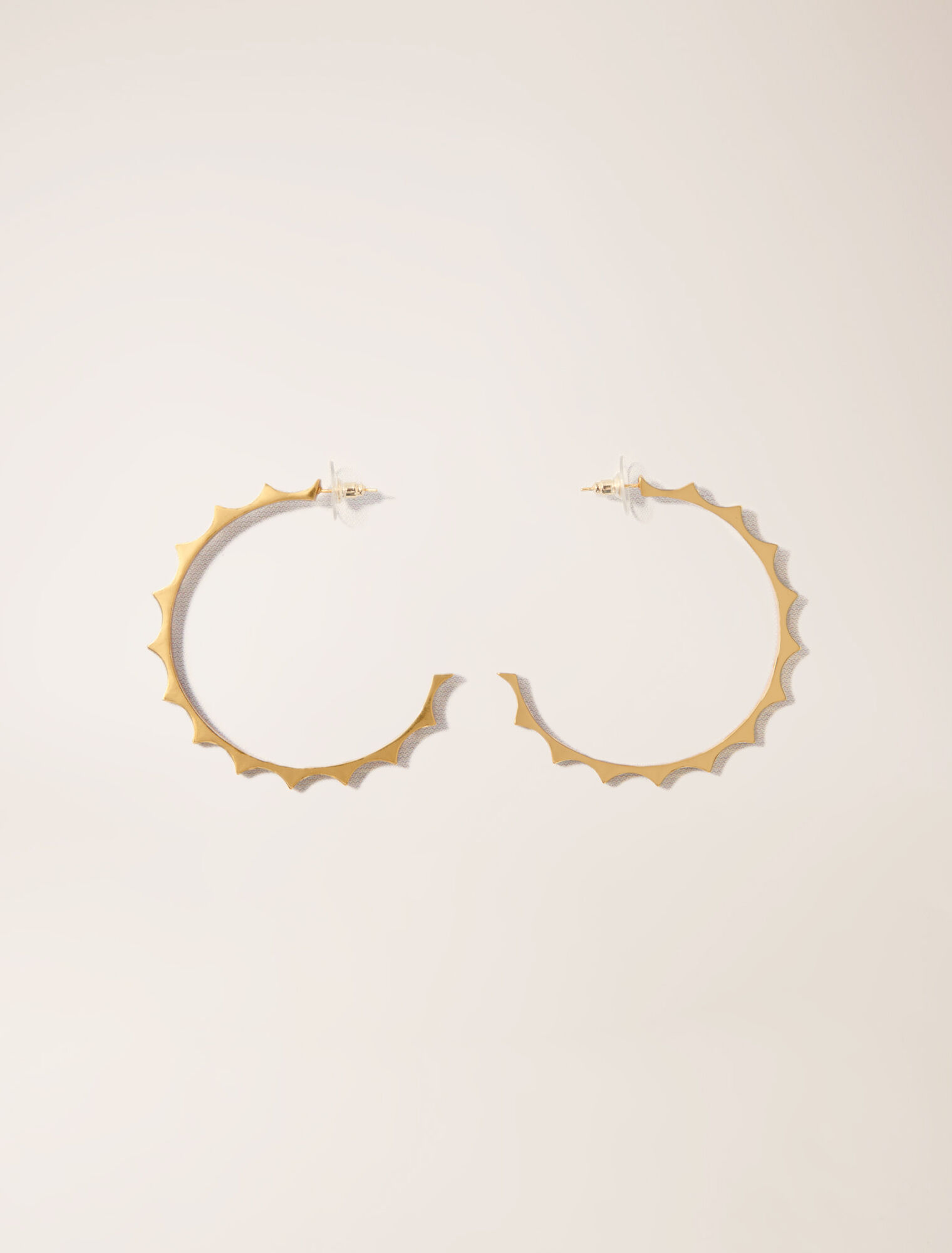 Gold tapered metal hoop earrings