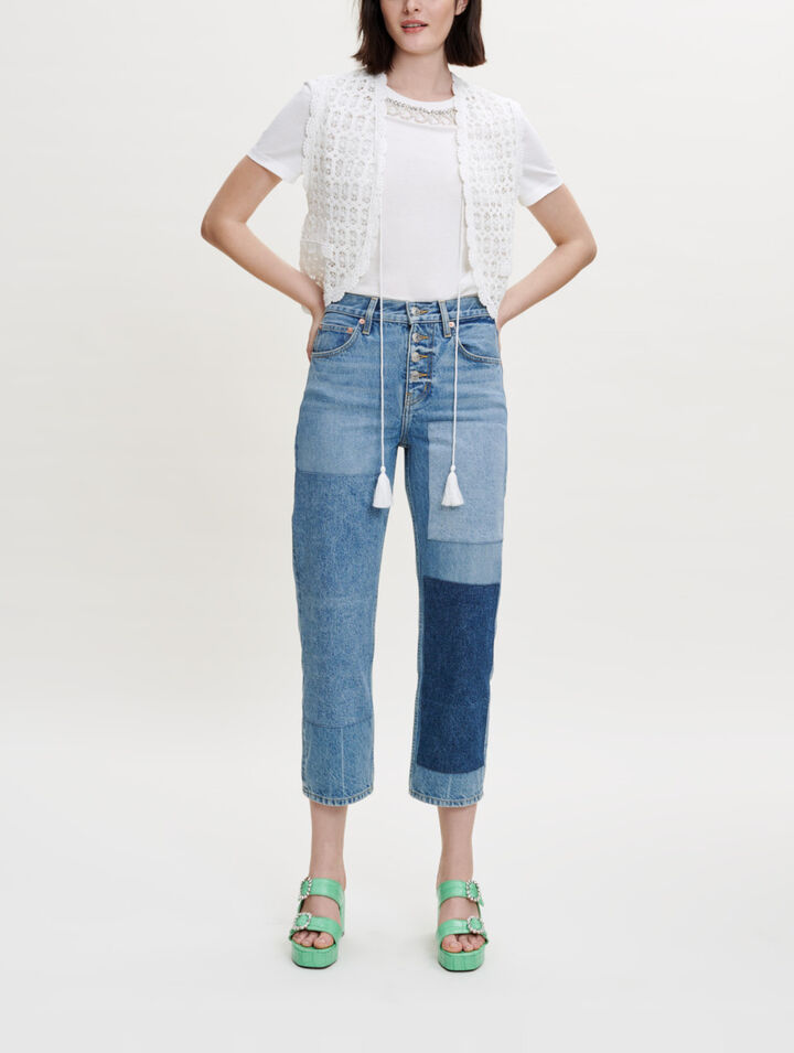 Small sleeveless jacket in guipure