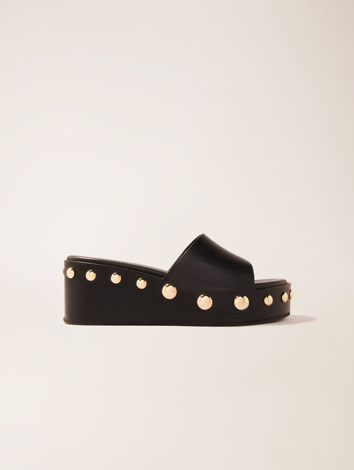 Mules compensées en cuir à studs