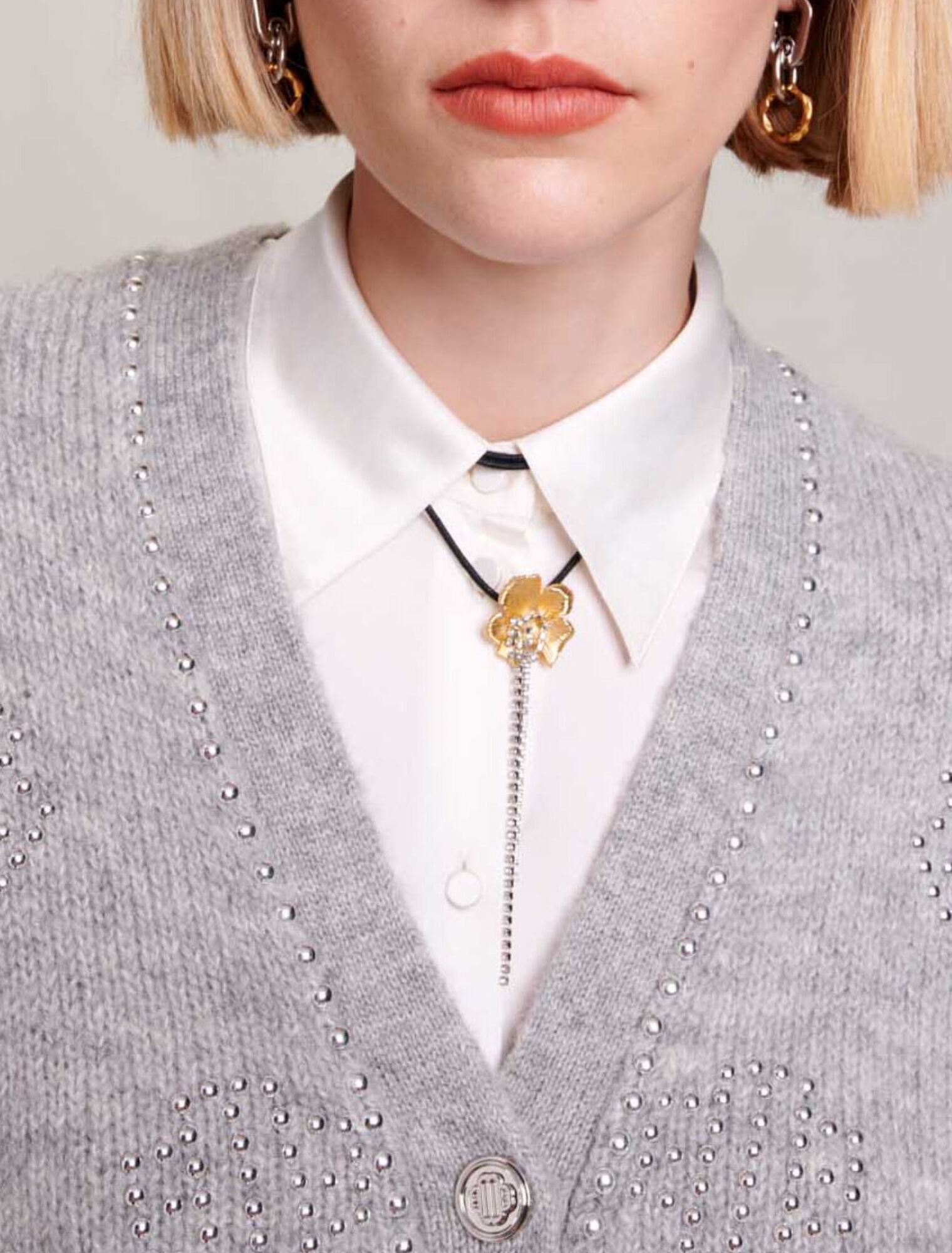 Cardigan with clover studs