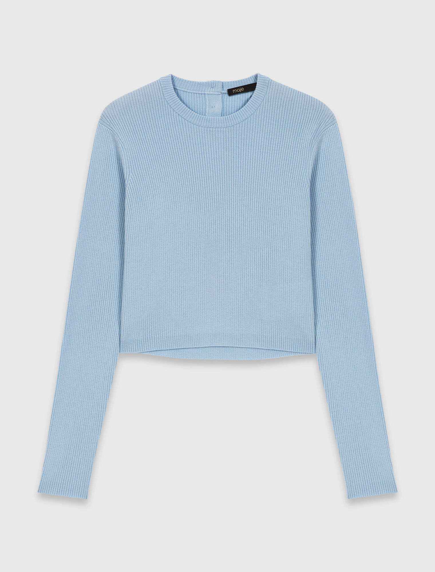 Pull avec boutons bijoux sur le dos