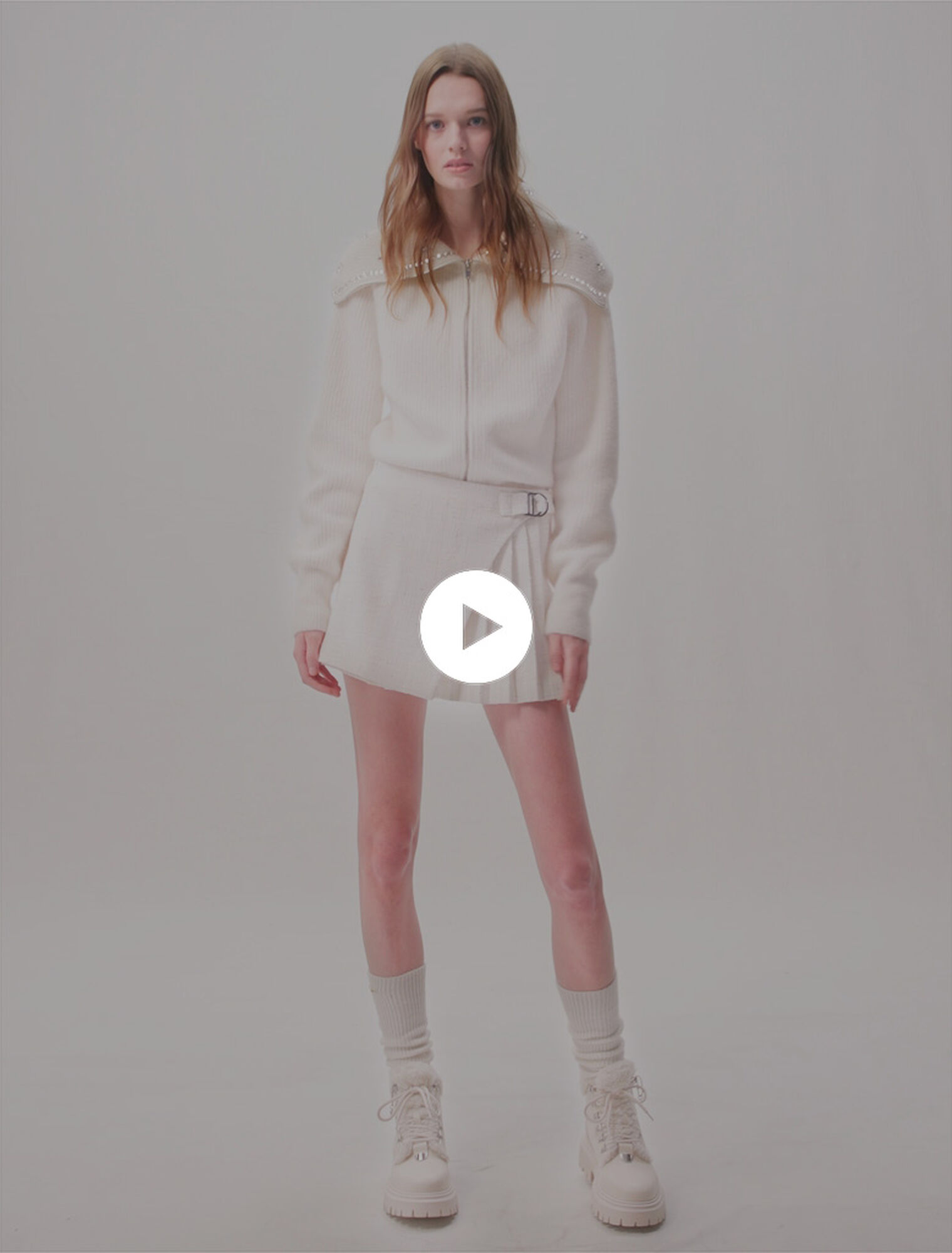 Jupe short plissée en tweed